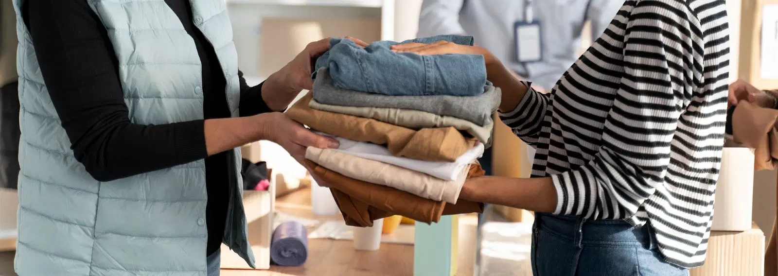 Volunteers folding clothes1